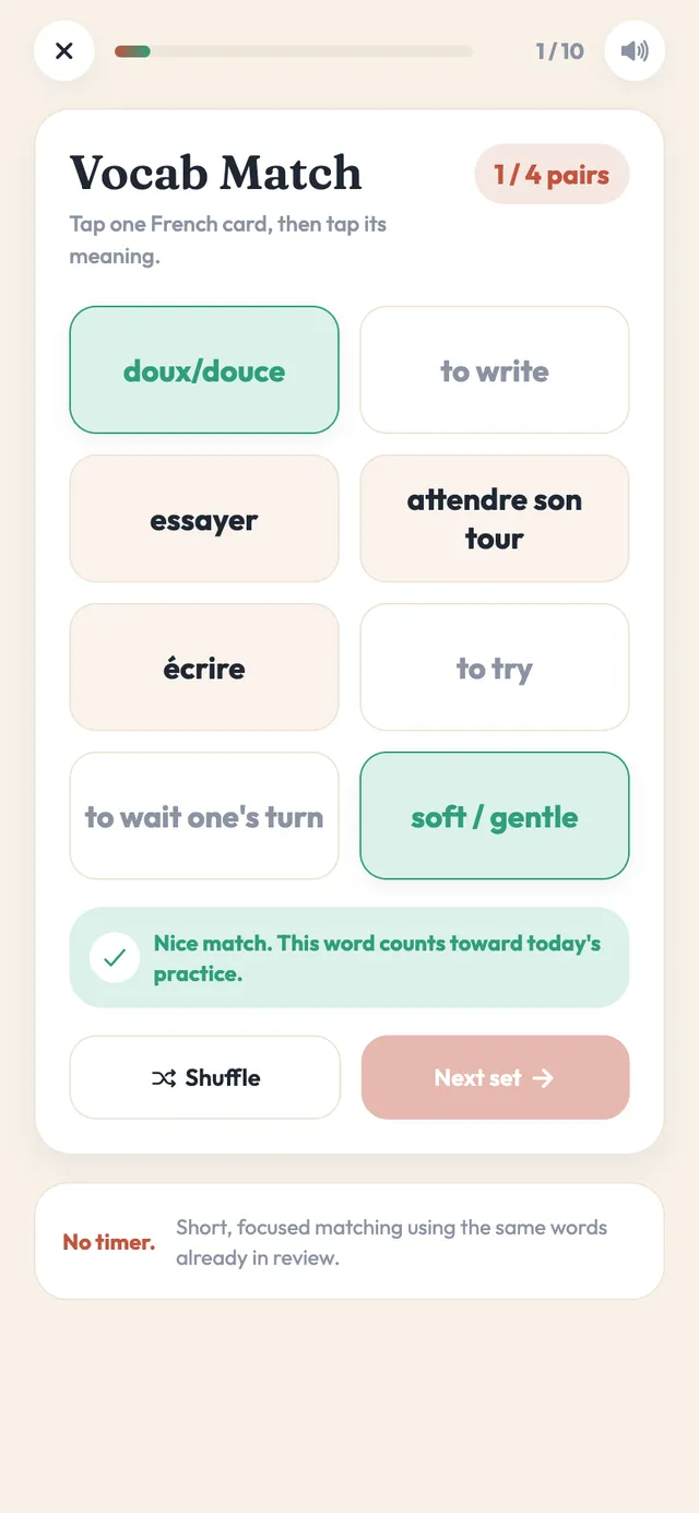 The Vocab Match board in the app: four French words and four meanings laid out as tiles, with a matched pair highlighted in green and a shuffle and next-set control below